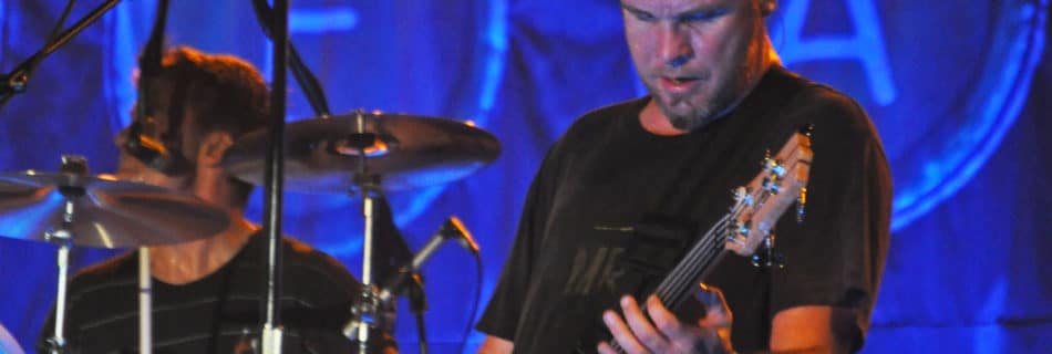 Bassist Jeff Ament performing with Pearl Jam. Author: Craig Carper. (Wikimedia Commons, CC BY 2.0)